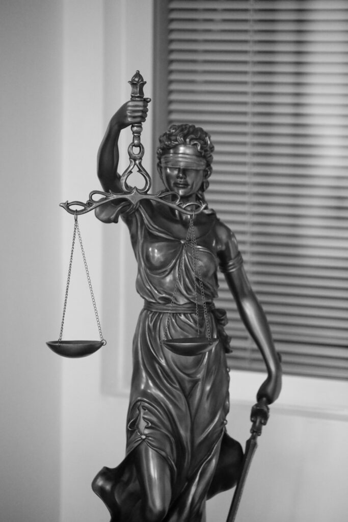 A COMPREHENSIVE ANALYSIS OF THE INAMDARI SYSTEM AND THE RECOGNITION BY THE BRITISH GOVERNMENT Elegant black and white photo of Lady Justice statue, symbolizing fairness and law.