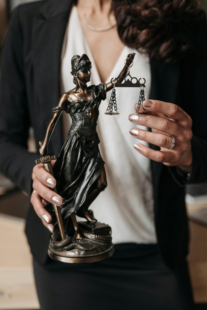 THE CONSTITUTIONAL CONTOURS OF NON-CONNECTIVITY: REIMAGINING THE “RIGHT TO BE OFFLINE” AND “DIGITAL ANONYMITY” UNDER ARTICLE 21 Close-up of Lady Justice statuette held by a lawyer, symbolizing law and justice.